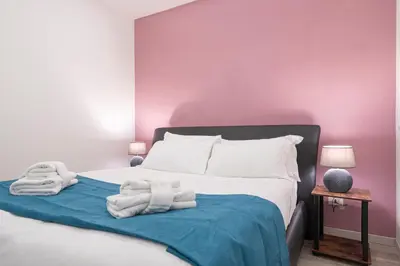 a bedroom with a bed with towels on it at Piazza Cavour Apartment 90 in Rome