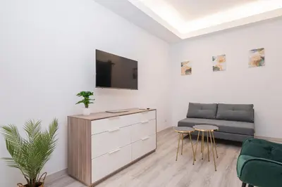 a living room with a couch and a chair at Piazza Cavour Apartment 90 in Rome