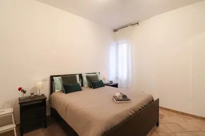 a bedroom with a large bed in a room at Oasi di relax a Monteverde in Rome