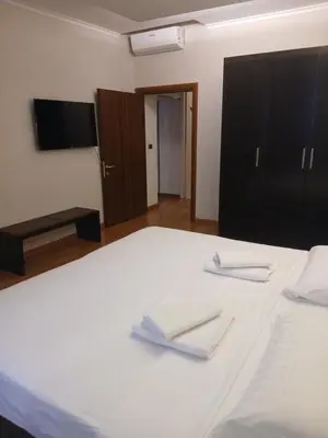 a bedroom with a bed with white towels on it at StefanoHouse Barberini 2 appartamenti in Rome