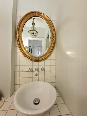 a bathroom with a sink and a mirror at Melli's R-Home in Rome