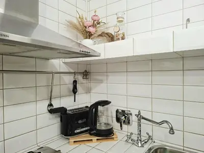 a kitchen counter with a mixer and a sink at Melli's R-Home in Rome