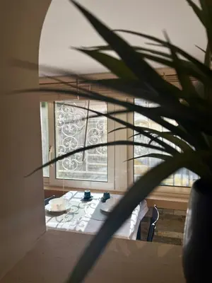 a room with a table in front of a window at Vatican Staircase in Rome