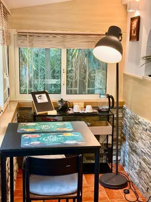 a dining room with a table and a lamp at Vatican Staircase in Rome