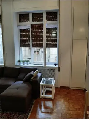 a living room with a couch and a table at Diana's Loft in Rome