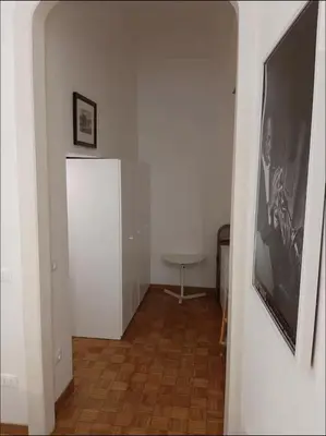 a hallway with a mirror and a picture on the wall at Diana's Loft in Rome