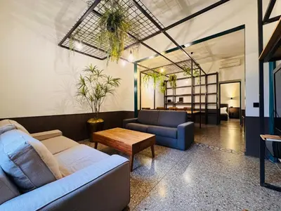 a living room with a couch and a table at Loft Penta - apartment Colosseum in Rome