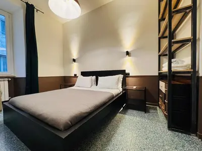 a bedroom with a large bed in a room at Loft Penta - apartment Colosseum in Rome