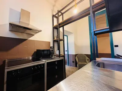 a kitchen with a sink and a stove at Loft Penta - apartment Colosseum in Rome