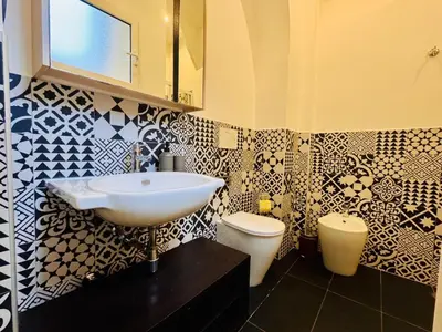 a bathroom with a sink and a toilet at Loft Penta - apartment Colosseum in Rome