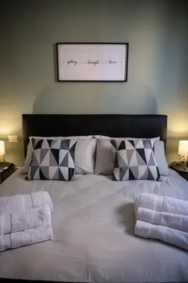 a bed with two pillows on top of it at Maison Monteverde, Trastevere in Rome