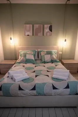 a large bed with towels and pillows on it at Maison Monteverde, Trastevere in Rome