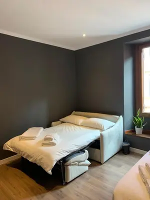 a bedroom with two beds in a room at San Lorenzo Elegance Suites - just steps from the Colosseum in Rome