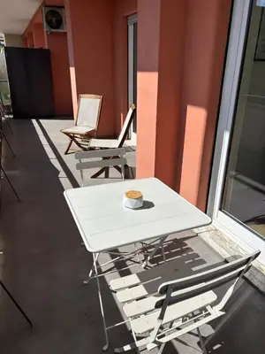 a white table and chairs in a room at Benny's House Rome in Rome