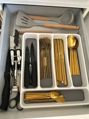 a drawer filled with utensils and other kitchen utensils at Benny's House Rome in Rome