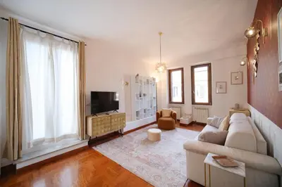 a living room with a couch and a tv at Terrazza Monteverde by BuddyRent in Rome