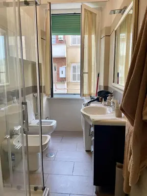 a bathroom with a toilet and a sink and a shower at Miss Giulia Prime location flat in Rome in Rome