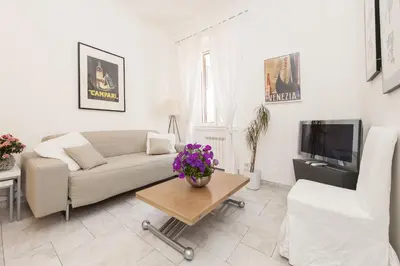 a living room with a couch and a table at Foscolo al 24 in Rome