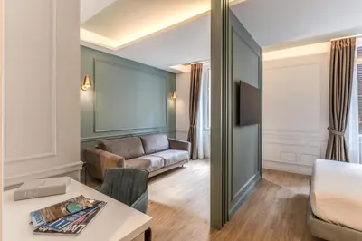 a living room with a couch and a table at Maison Della Vite in Rome