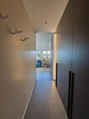 a hallway leading to a living room with at La casetta del villaggio - Cozy apartment in Flaminio in Rome