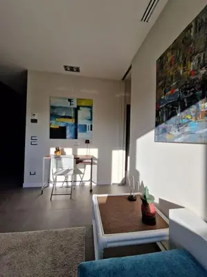 a living room with a couch and a table at La casetta del villaggio - Cozy apartment in Flaminio in Rome