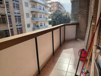 a balcony with a view of a building at Regina di Cuori in Rome