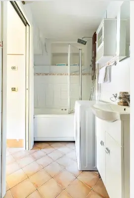 a white bathroom with a tub and a sink at Appartamento Roma centro 2 da 2 a 4 posti 
