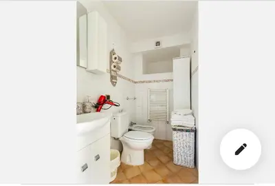 a white bathroom with a toilet and a sink at Appartamento Roma centro 2 da 2 a 4 posti 
