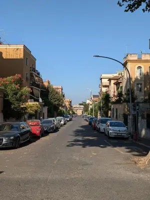 a street with cars parked on the sides of the road at Interno7 in Rome
