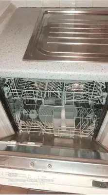a dish rack in an oven with dishes in it at Lovely Apartment at Saint Peter's Square Vatican in Rome