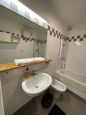 a bathroom with a sink and a toilet and a tub at Lovely Apartment at Saint Peter's Square Vatican in Rome