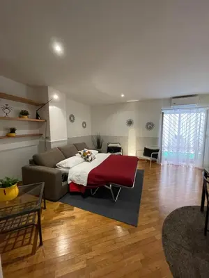 a living room with a bed and a couch at Lovely Apartment at Saint Peter's Square Vatican in Rome
