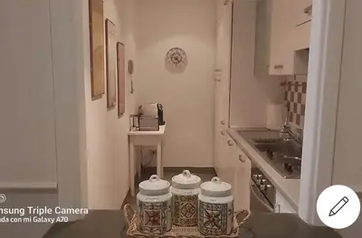 a small kitchen with a sink at Lovely Apartment at Saint Peter's Square Vatican in Rome
