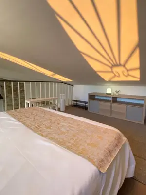 a bedroom with a large bed with a large ceiling at Dimora Ardeatina in Rome