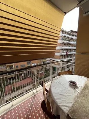 a balcony with a table and a view of a building at Silvana vatican apartment in Rome