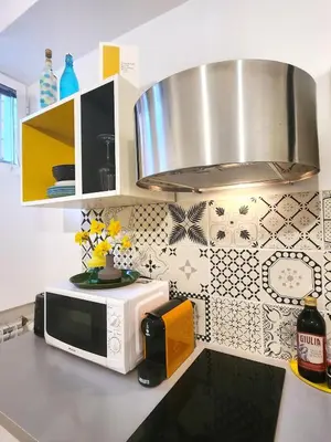 a kitchen with a microwave on a counter top at Sanpietrino Home in Rome