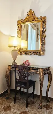 a bathroom with a sink and a mirror at VATICANO Apartment in Rome