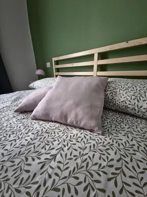 a bed with two pillows on it in a bedroom at Casa Milly in Rome