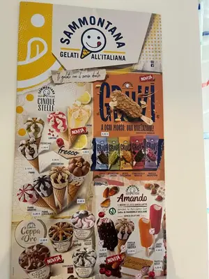 a display of food ads on a wall at Casa Milly in Rome