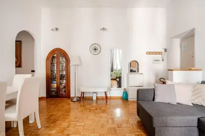 a living room with a couch and a table at Suite Testaccio in Rome