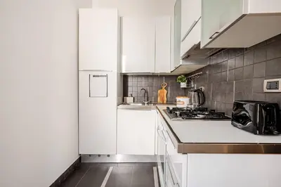 a dining room with a table and a television at Suite Testaccio in Rome