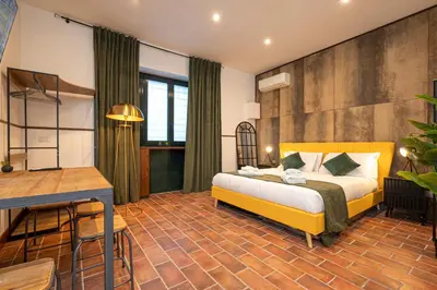 a hotel room with a bed and a desk at Trastevere 1 in Rome