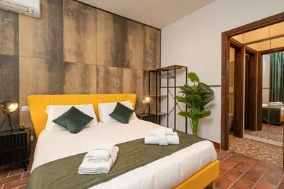 a bedroom with a large bed with towels on it at Trastevere 1 in Rome