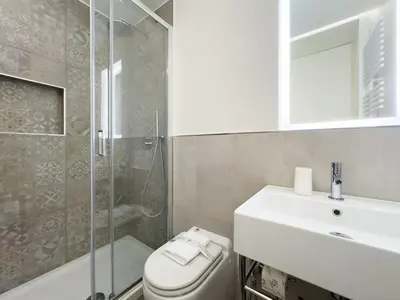 a bathroom with a toilet and a sink and a shower at Gold Suite 5 minuti dal Colosseo in Rome