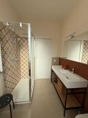 a bathroom with a sink and a shower at Casa dei Parchi in Rome