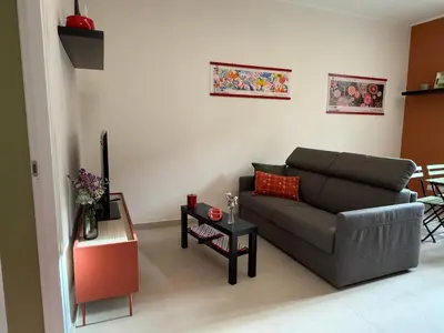 a living room with a couch and a table at Casa dei Parchi in Rome