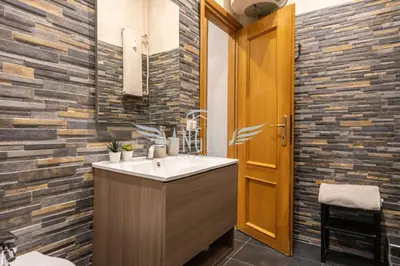a bathroom with a sink and a toilet at BlueHouse Roma, ampia casa per gruppi e famiglie in Rome