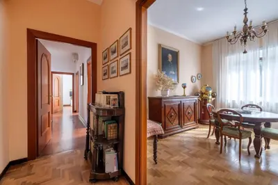 a living room with a table and a dining room at Roman Retreat Near the Appian Way & Catacombs in Rome