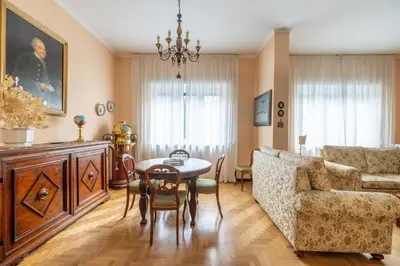 a living room with a table and a couch at Roman Retreat Near the Appian Way & Catacombs in Rome