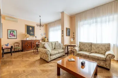 a living room with two couches and a coffee table at Roman Retreat Near the Appian Way & Catacombs in Rome